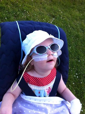 Sophie: young girl smiles wearing sunglasses