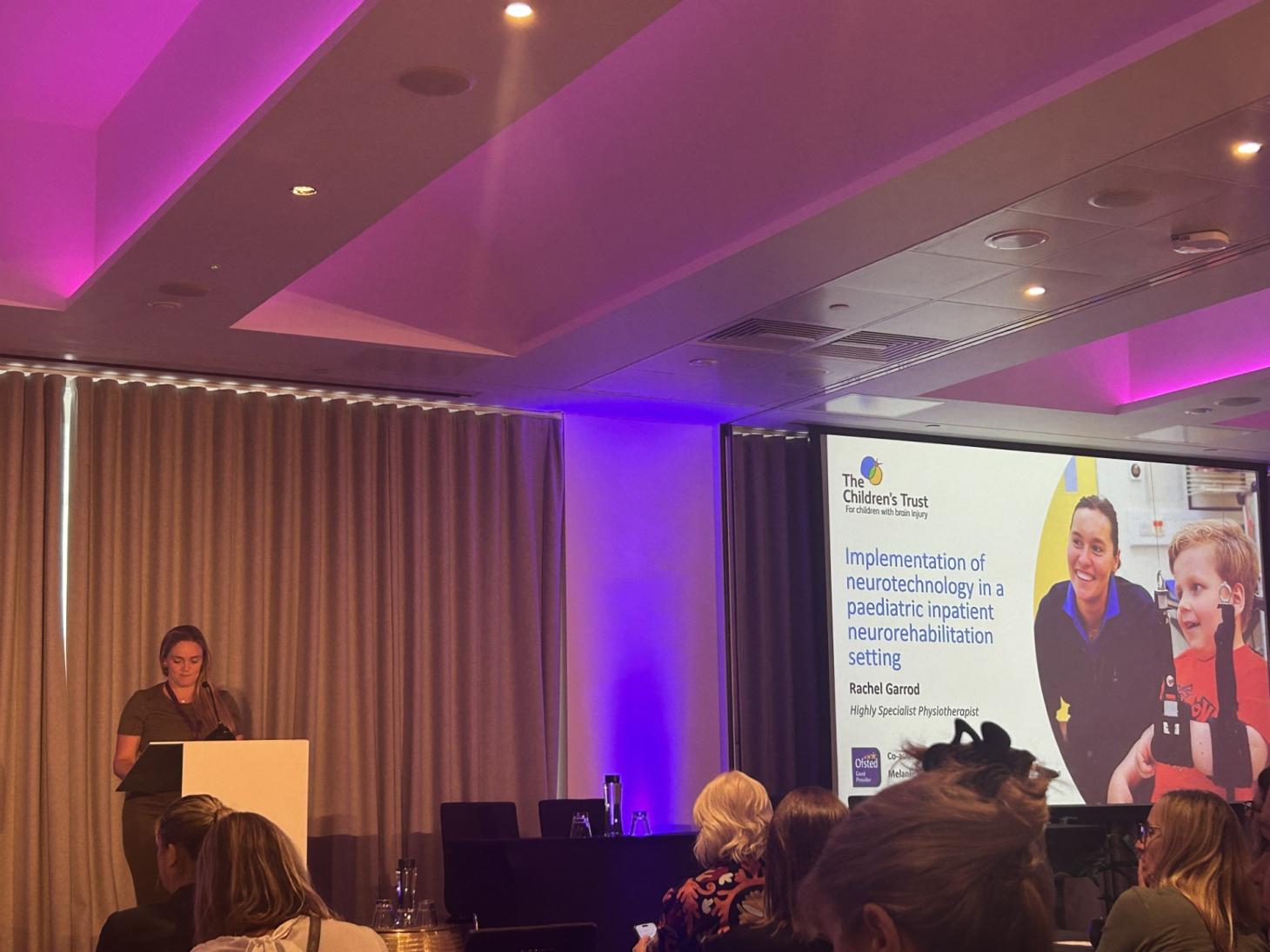 Staff member presenting at a conference