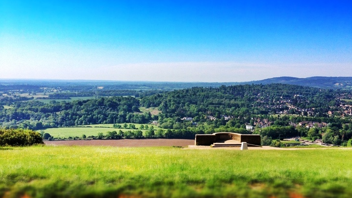 sprawling Surrey green hills from the ancient viewpoint at Box Hill set against turquoise skies