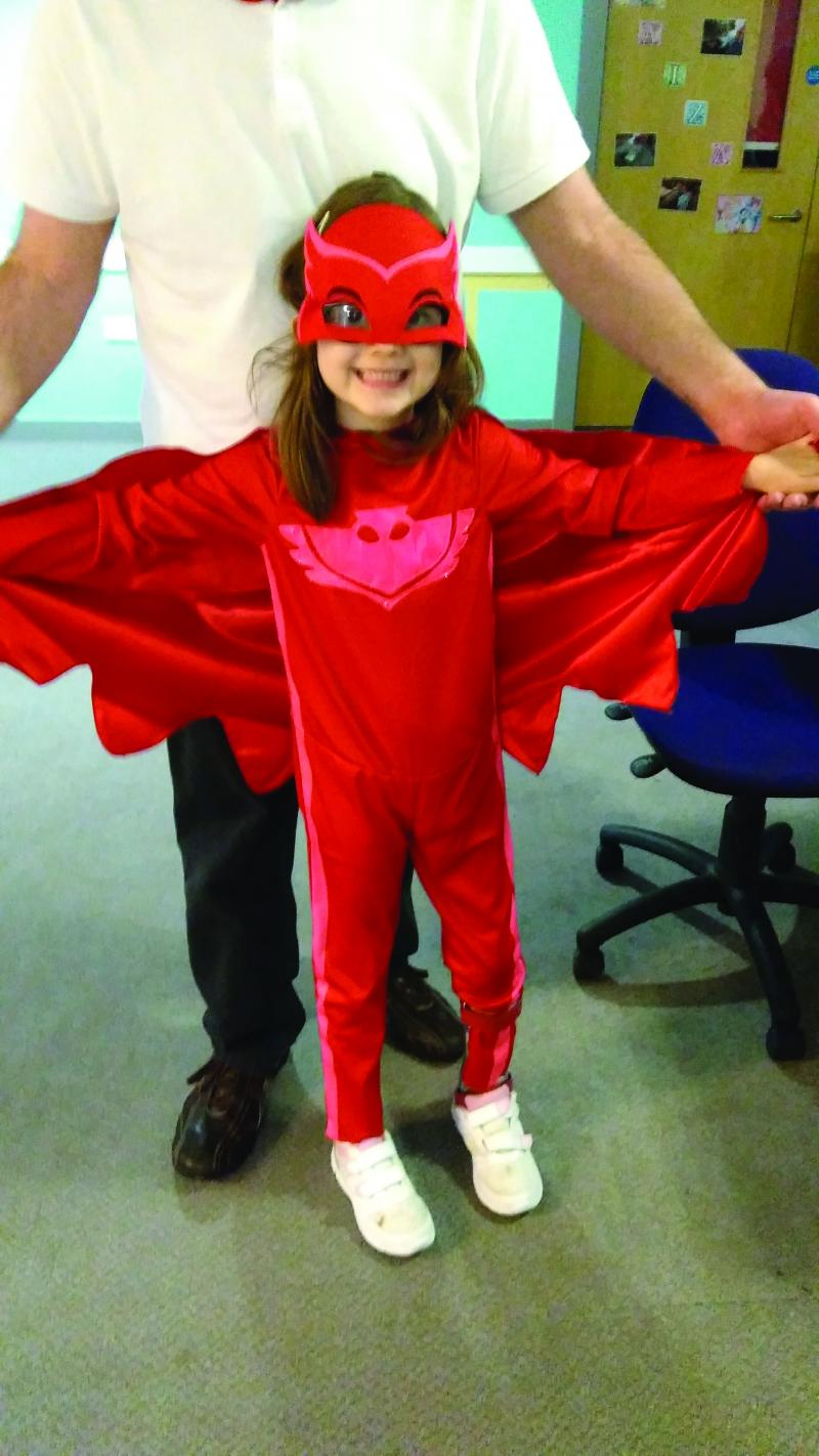 Emma in a red fancy dress costume