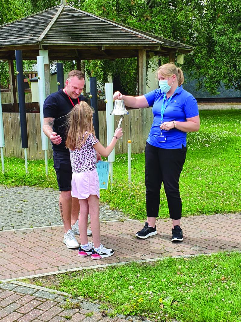 Lily ringing the going home bell
