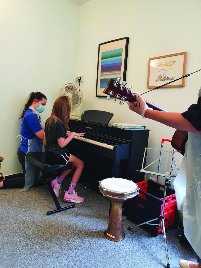 Lily in music therapy