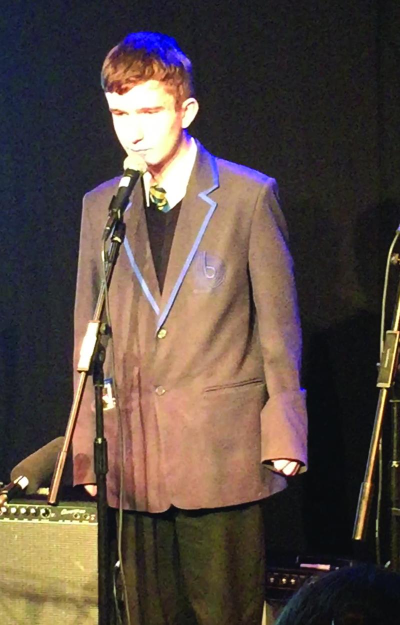 Paul speaking at an event in school