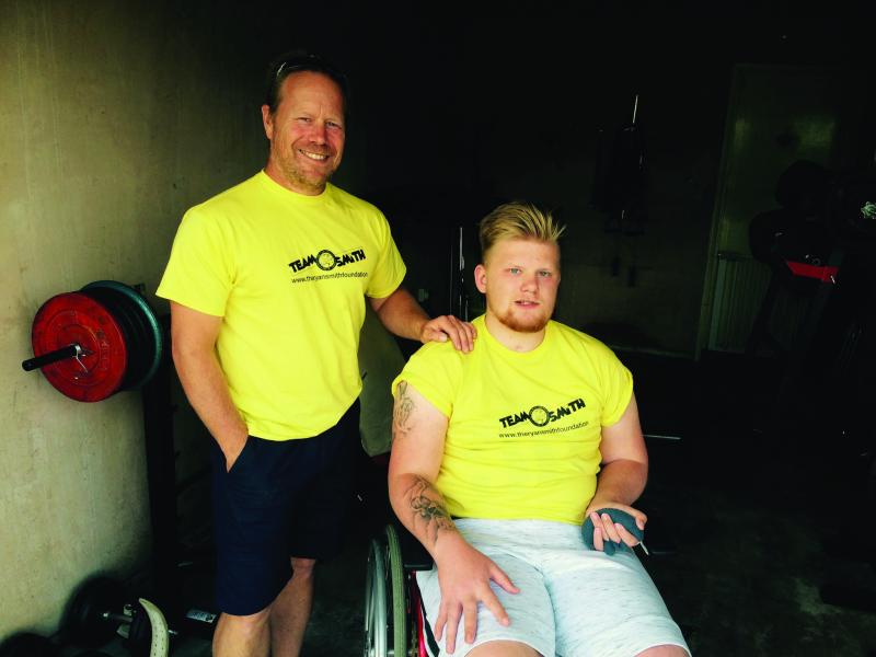 Ryan with his dad in Team Smith t-shirts