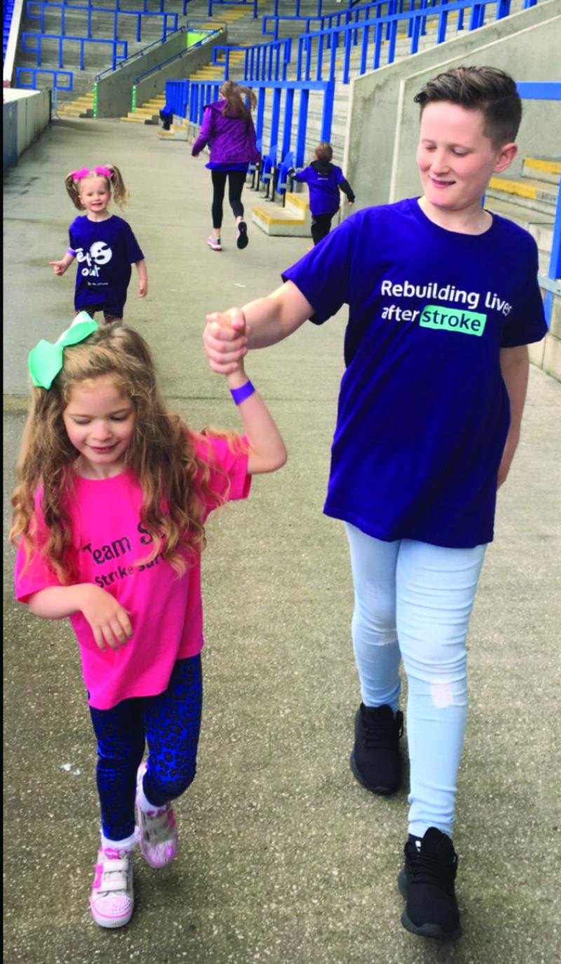 Sofia-Rose and her brother doing a walking challenge